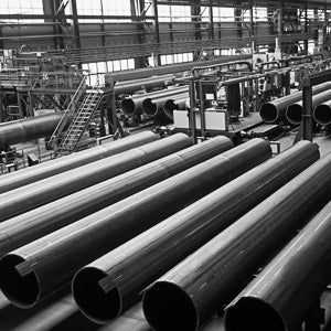 Pipes stacked together inside a pipe mill