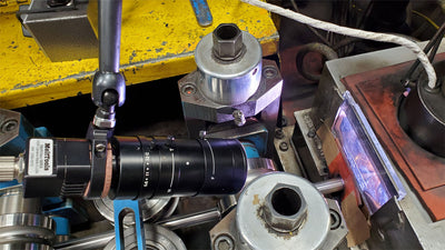 MeltView® MIRA3 weld monitoring camera with varifocal lens in a welding environment.